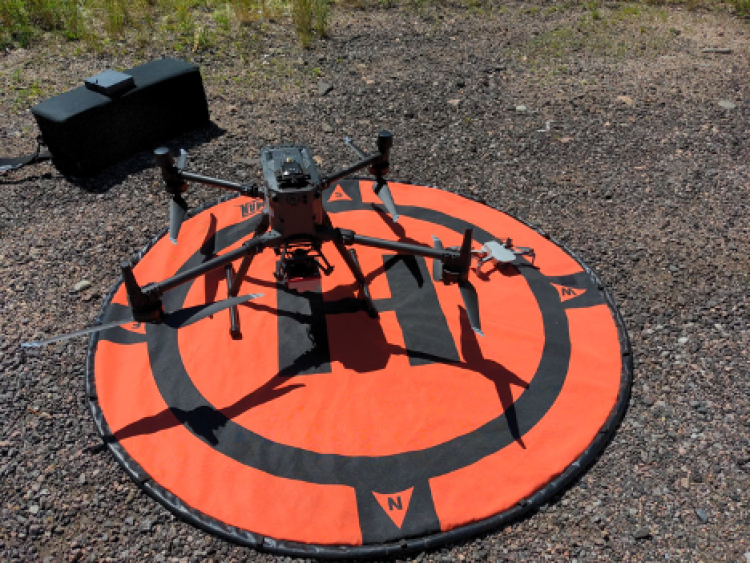 Drone on landing pad