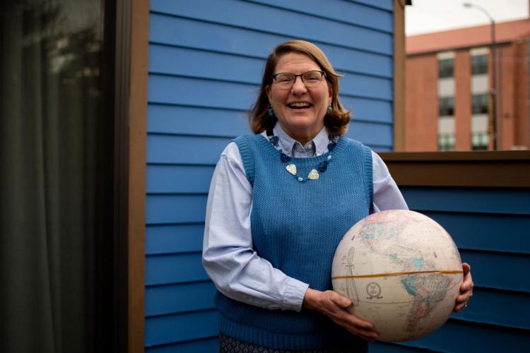 Woman holding a globe
