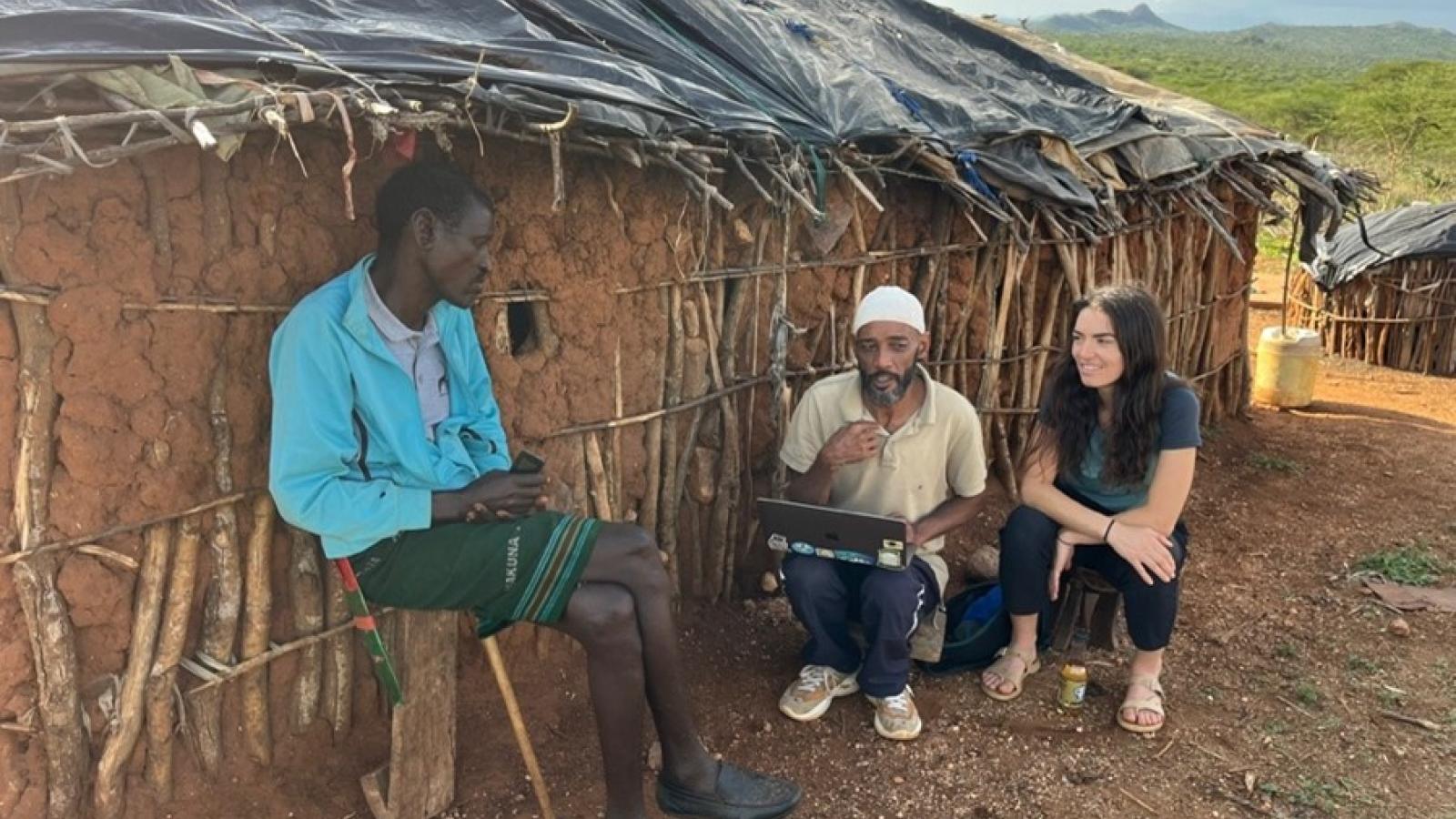 Posner and her Research Assistant, Noor Hussein Noor, piloting the questionnaire with a Samburu pastoralist at his manyatta (homestead) March 2025