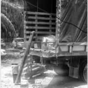 Back end of truck with items laying on the ground