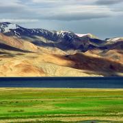 Tibetan plateau with mountains vista and grassland