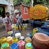 Residents collect drinking water from a municipal tanker in Kolkata, India