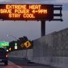 Cars driving under sign