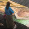 woman overlooking vast water project with dam