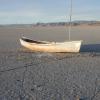 old boat on a dry lake bed