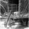 Back end of truck with items laying on the ground