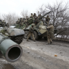 Ukrainian servicemen get ready to repel an attack in Ukraine's Lugansk region on February 24, 2022.  ANATOLII STEPANOV