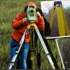Woman using surveying equipment