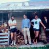 Group standing on front porch of old house in New Zealand
