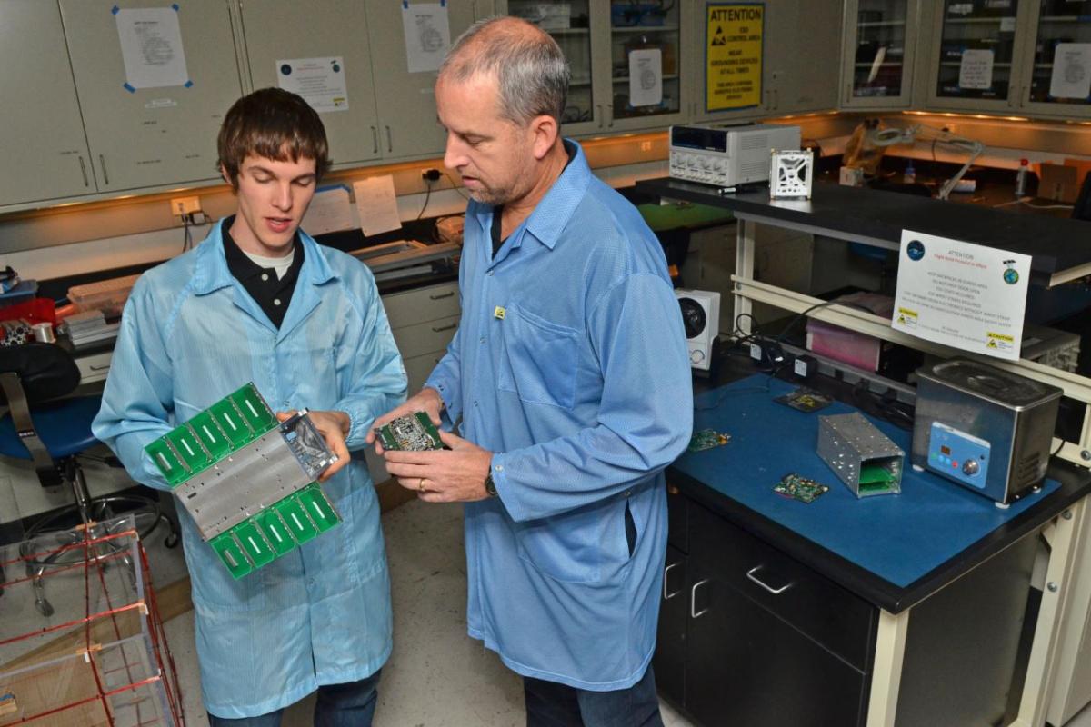 Faculty and student working in a lab