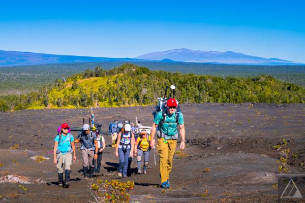 People hiking on rocky landform