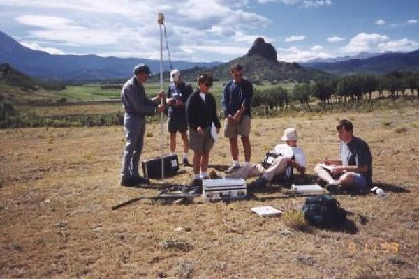 students doing research in mountain valley