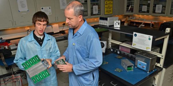 Faculty and student working in a lab