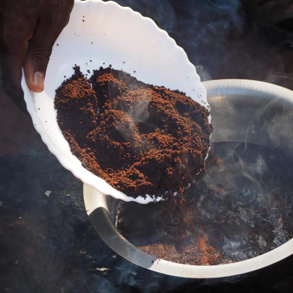 Pouring ingredients into pot