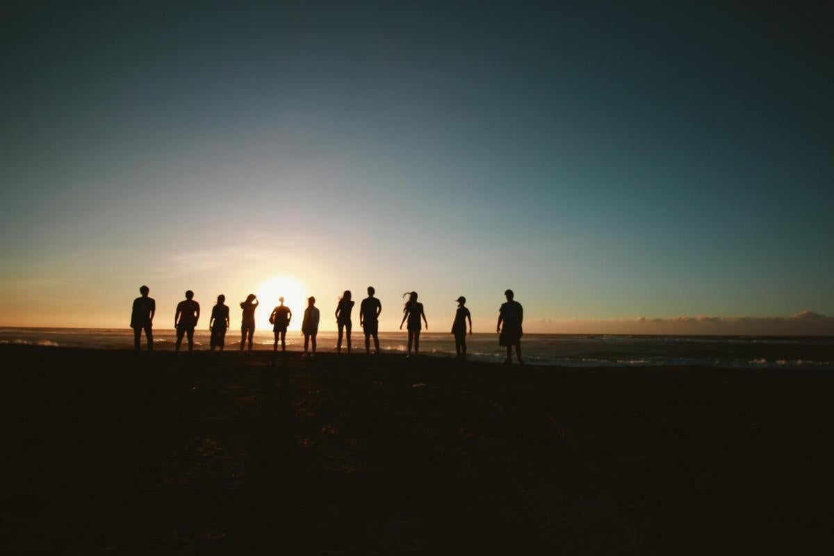 Silhouette of people at sunset