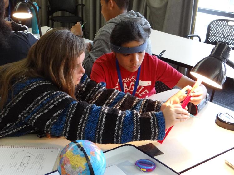 Students participate in a climate-based lesson during a workshop at CU Boulder