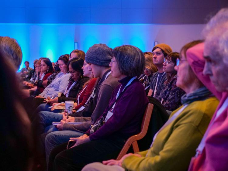 Audience members listen intently to Sheila Watt-Cloutier giving her keynote address at the Right Here, Right Now Global Climate Summit.