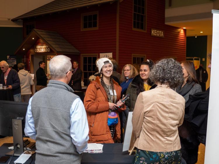 Melanie McMeans (Center) talks with other attendees at The ChancellorÕs Annual Summit.