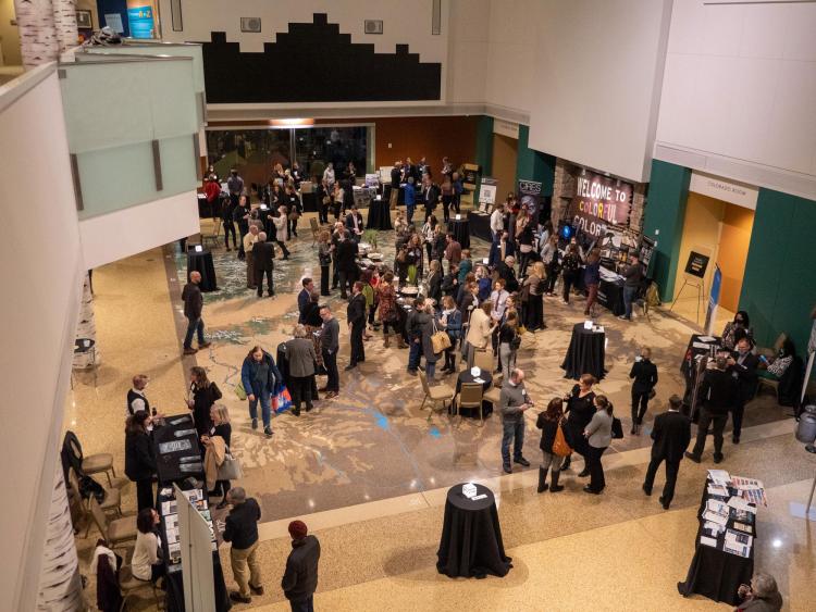 Attendees mingle and visit booths during The Chancellor's Annual Summit.