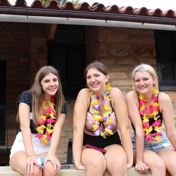 Group of three students at the Luau 
