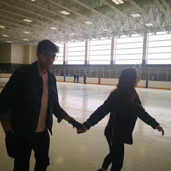 Happy couple ice skates