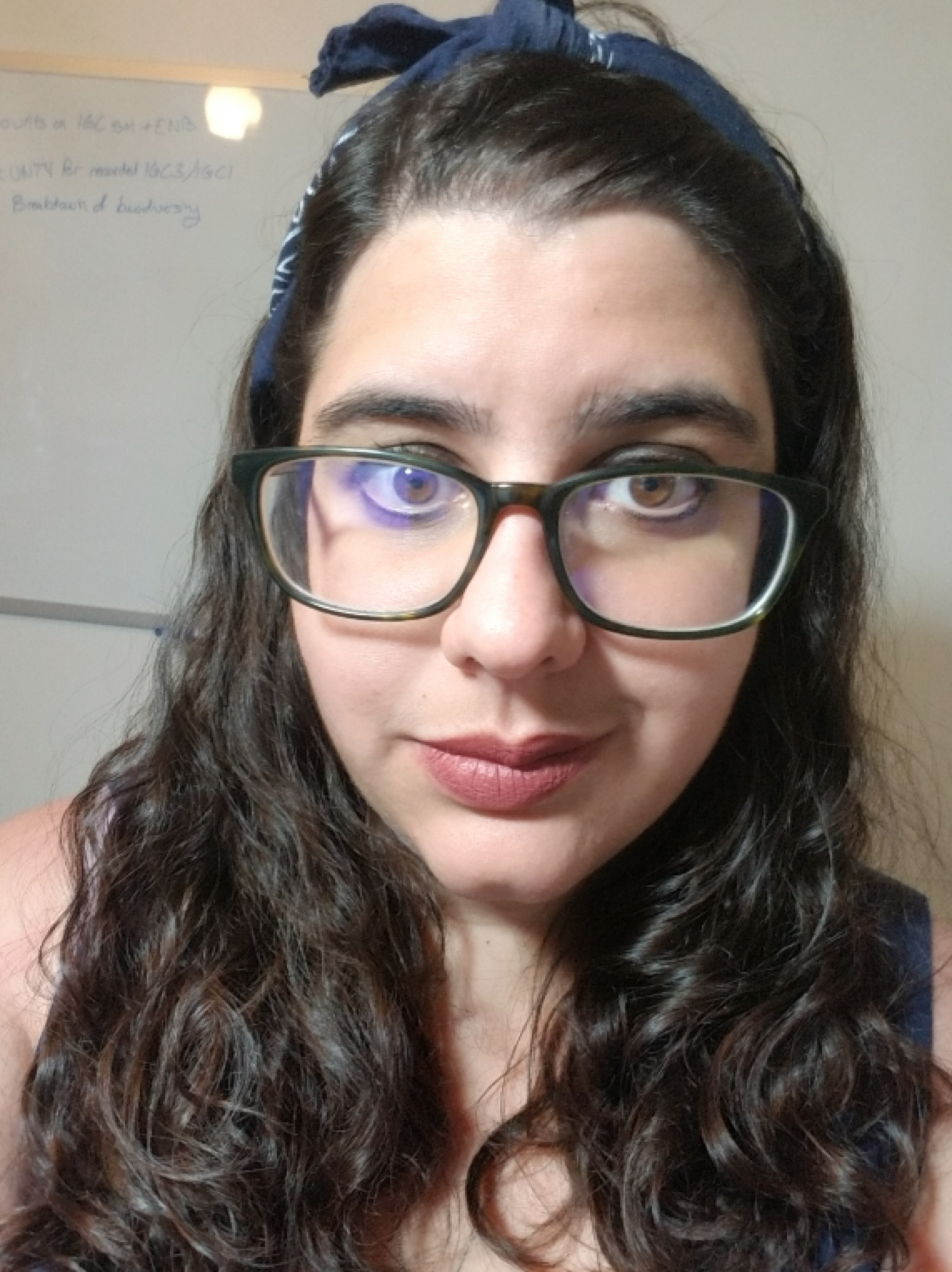 picture of Emily in front of a white board