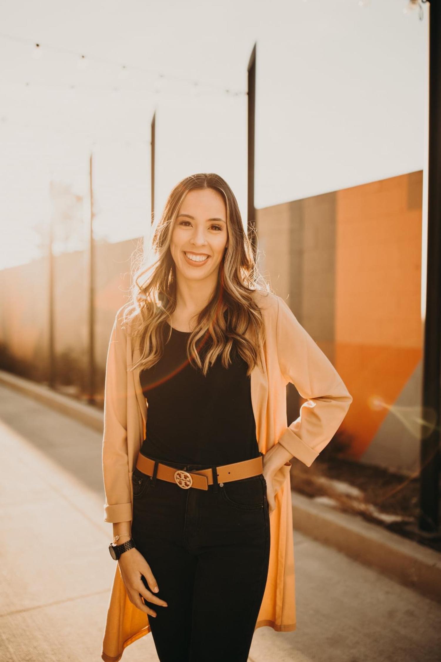 Vertical image of Jayne with the sun behind her