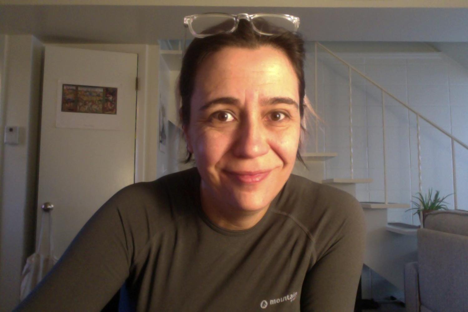 Sandra with glasses on top of her head