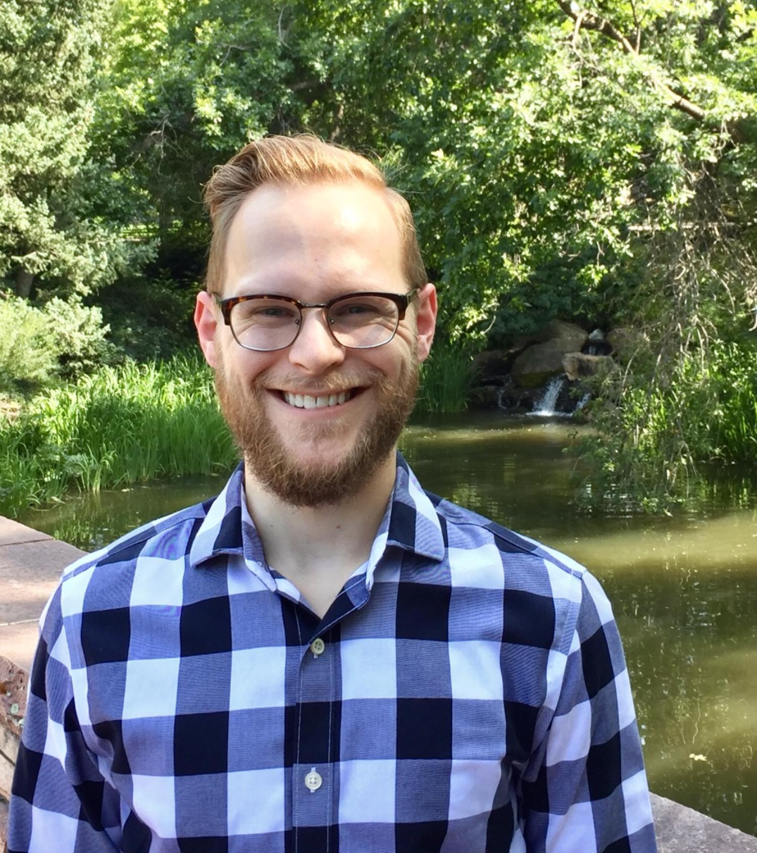 picture of Vincent in front of a pond