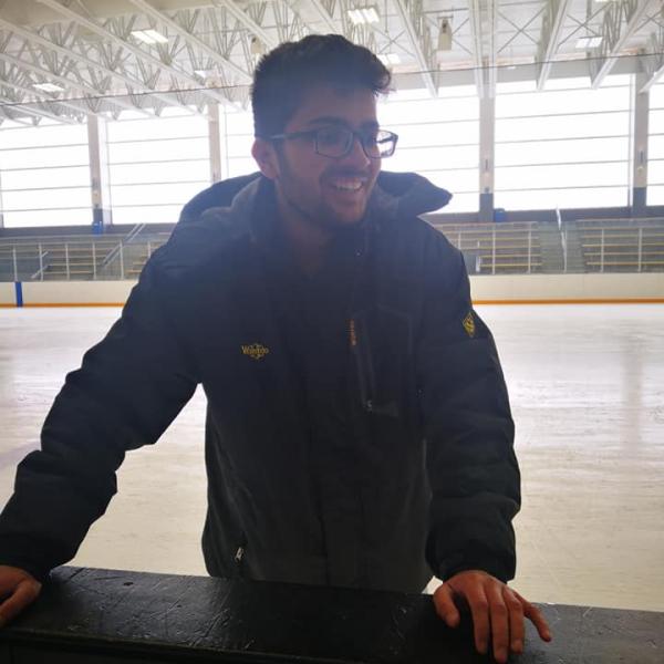 Grad student smiling on ice