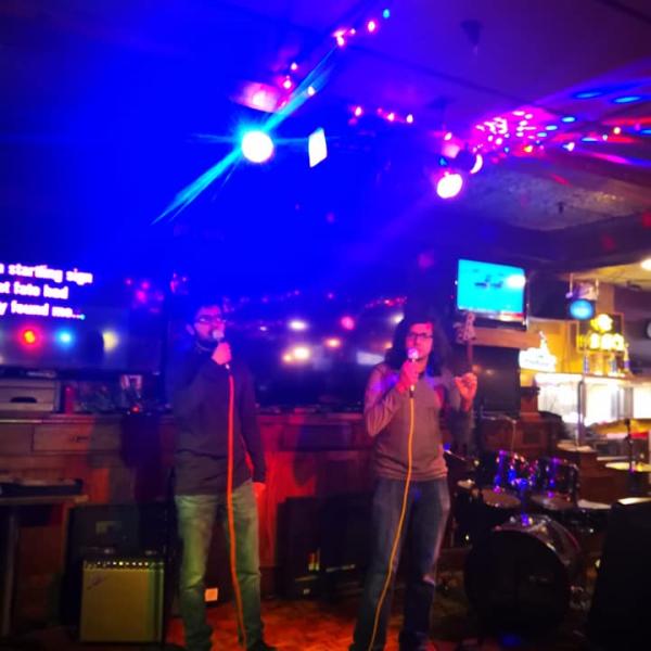 Pair of grad students performs karaoke number