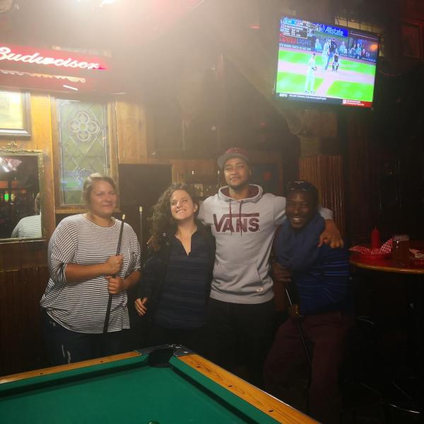 Grad students playing pool at UGGS Trivia Night