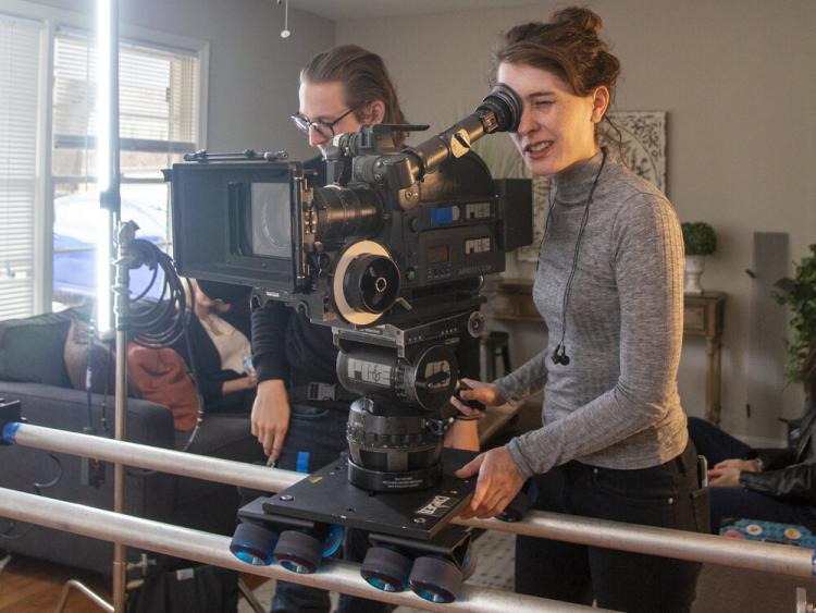 Kate behind a film camera