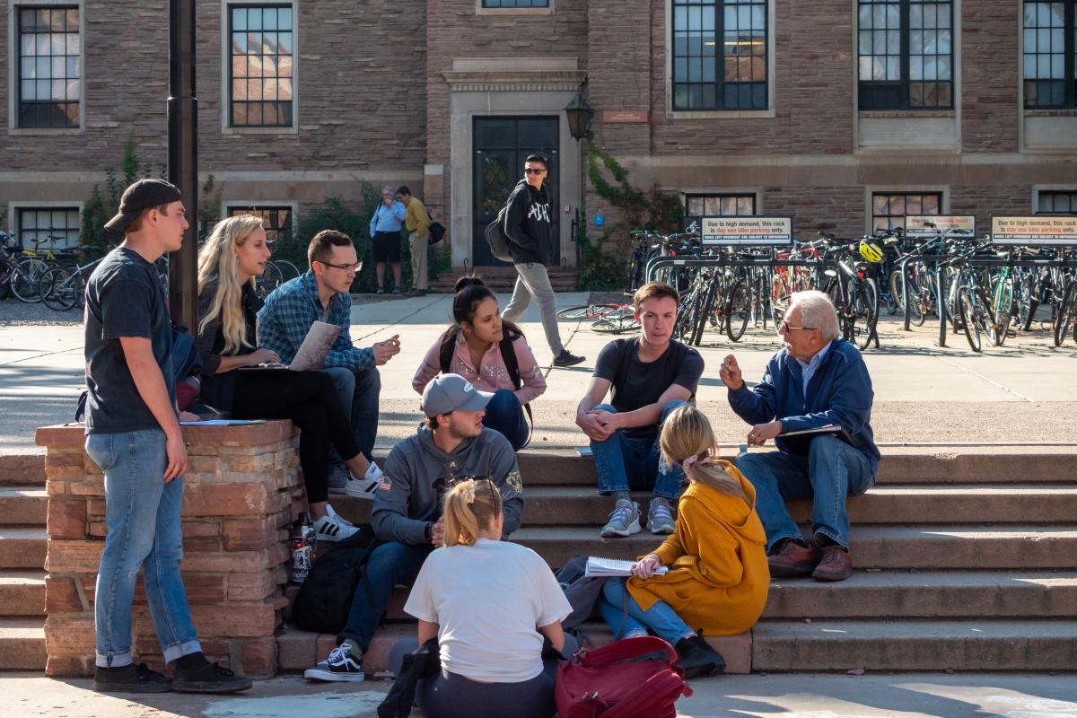 Students sitting in a circle outside of the UMC
