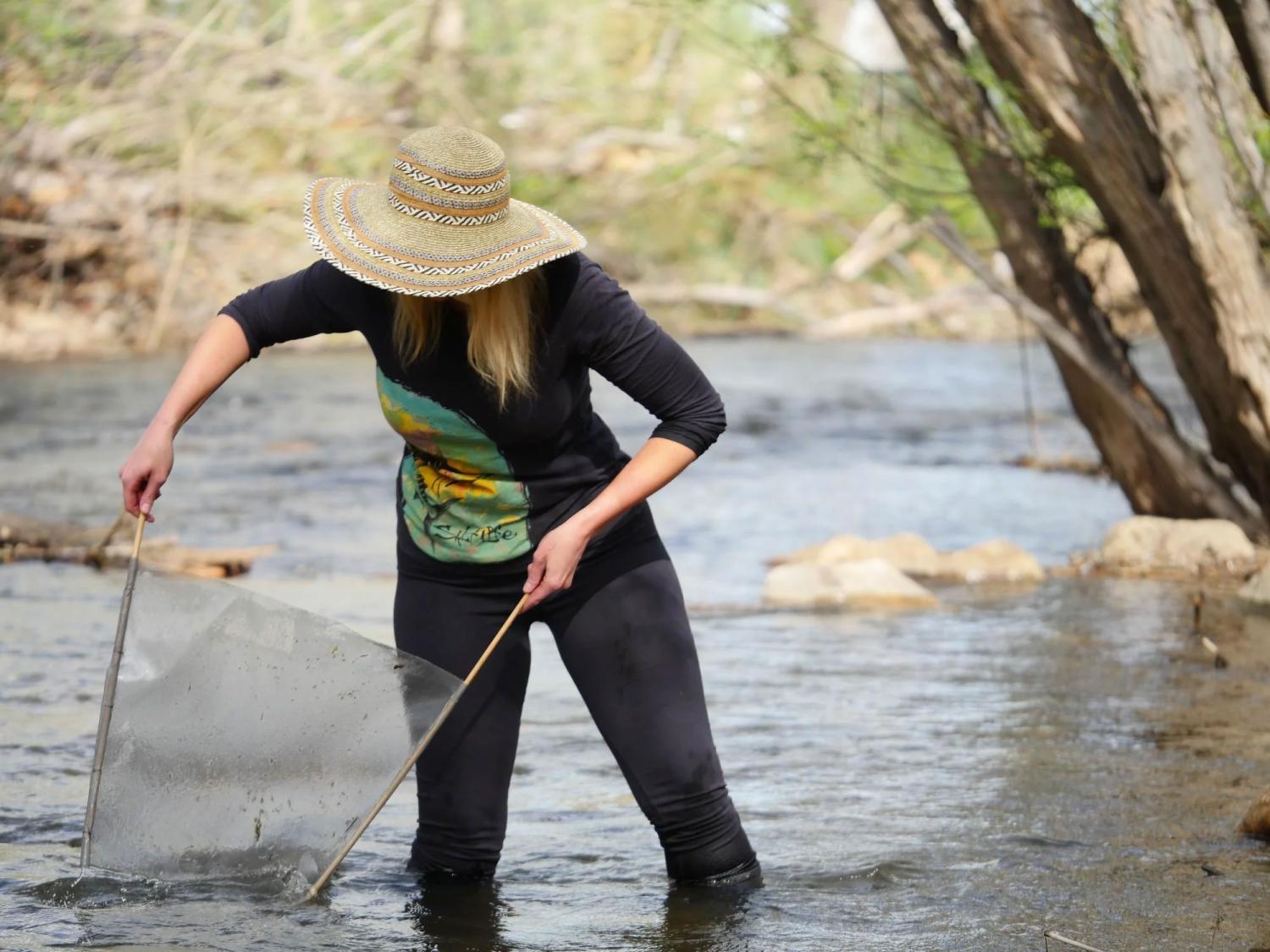 Julie Byle with a net in the Boulder Creek