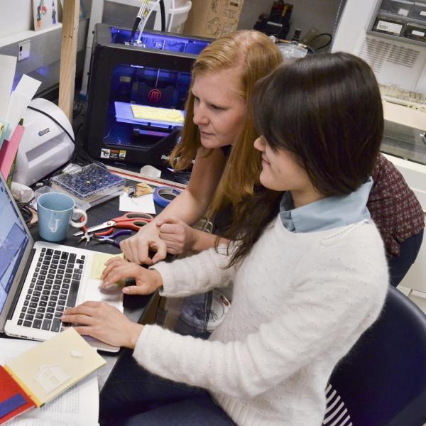 Two women working in a Linguistics lab