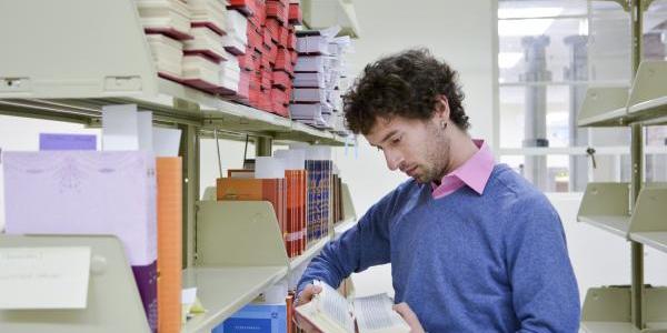 Eben Yonnetti reading in a library