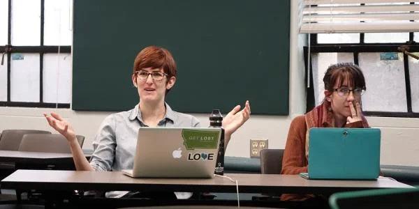 Students talking in a classroom