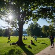 Students walking around on a gorgeous fall day on the Norlin Quad