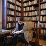 Student in library reading room