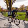 Student riding their bike in the Norlin quad