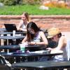 Students sitting at tables outside of the UMC