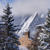 Snow scenic with the Flatirons and a campus building