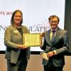 Zach Schiffman accepting the award after winning the 2024 Colorado 3MT final competition