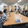 Students sitting around a table during a philosophy class