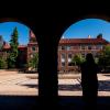 Student looking out at the Dumbo Fountain outside of the UMC