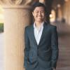Tuan Anh Nguyen standing beside a column