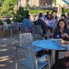 Graduate students chatting outside during the peer mentor meet and greet