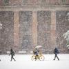 Students walking in front of the Norlin Library during the first snow of the season