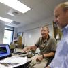University of Colorado Scholar in Residence and former astronaut Jim Voss, left, sits Tuesday with Steve Nerem, faculty director for the newly created space minor at the University of Colorado at Boulder.
